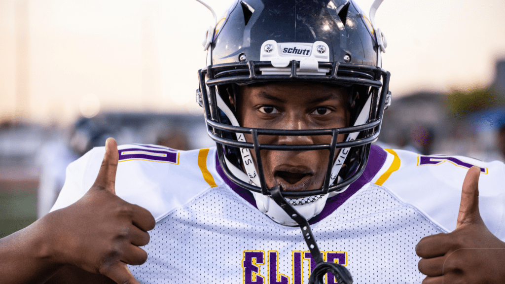 football player in white and purple shirt