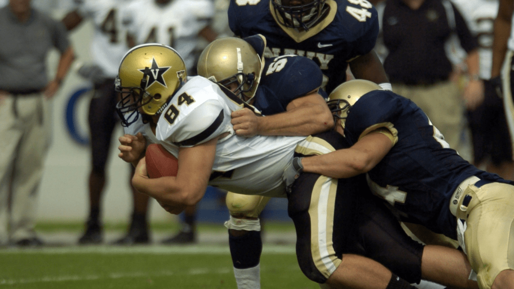 Football players showing defensive tactics