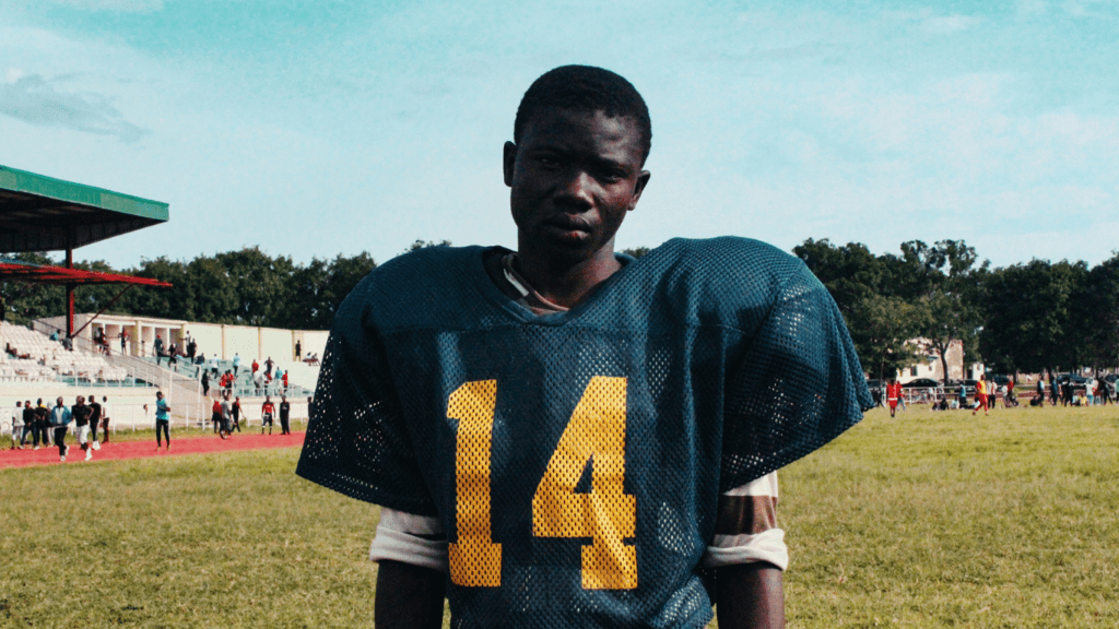 black american player of football in stadium