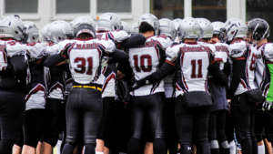 american football team cheering