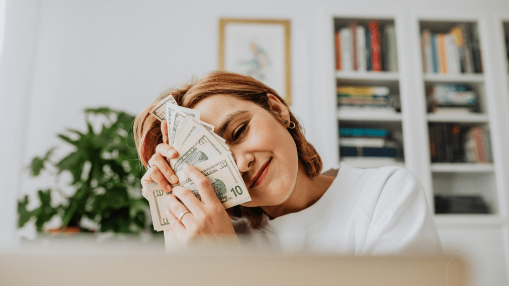 woman embracing money