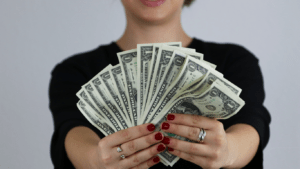 woman holding dollar bills