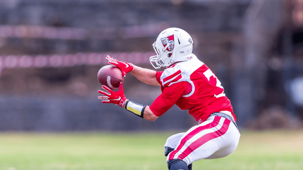 nfl player catching football