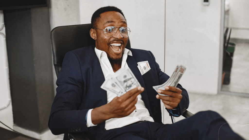 man happily counting his money