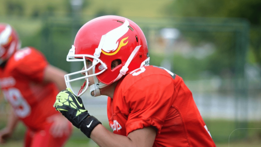 man wearing red football uniform